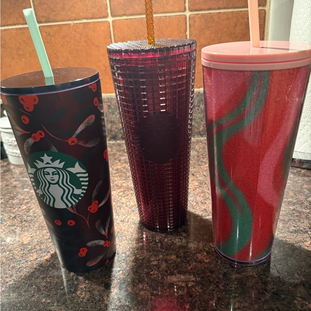 Starbucks Dark Floral, Purple Textured, and Red-Green Swirl Tumblers